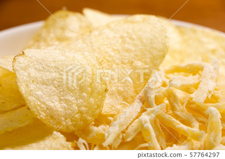 Assorted potato chips and squid squid. Snacks and snacks image. 57764297