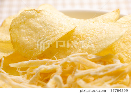 Assorted potato chips and squid squid. Snacks and snacks image. Assorted potato chips and squid squid. Snacks and snacks image. 57764299