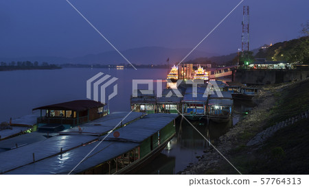 illuminate two travel Chinese boats park at pier,port of Chiang saen ,Chiang rai,Thailand . 57764313
