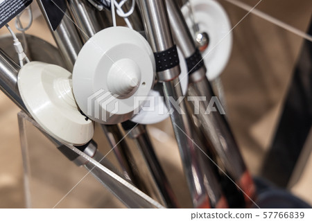 Closeup of retail security tag on merchandise to Closeup of retail security tag on merchandise to 57766839