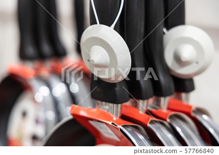 Closeup of retail security tag on merchandise to Closeup of retail security tag on merchandise to 57766840