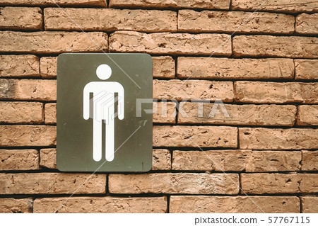 Male toilet symbols on red brick walls Male toilet symbols on red brick walls 57767115