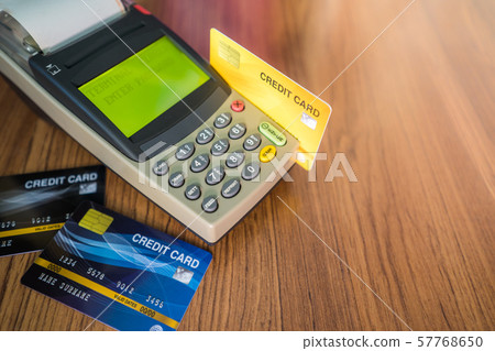 Many credit cards are used in the shop. Shopping Many credit cards are used in the shop. Shopping 57768650