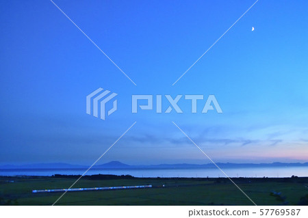 Muroran Main Line Express Super Hokuto running through the countryside along the afterglow eruption bay 57769587