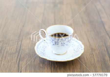 White cup & saucer with coffee White cup & saucer with coffee 57770170
