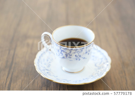 White cup & saucer with coffee White cup & saucer with coffee 57770178