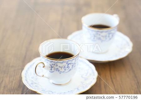 White cup & saucer with coffee White cup & saucer with coffee 57770196