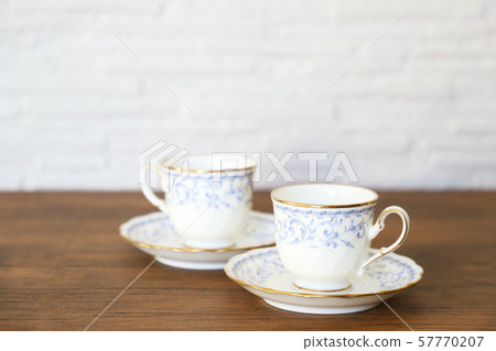 White cup & saucer with coffee 57770207