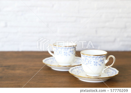 White cup & saucer with coffee 57770209