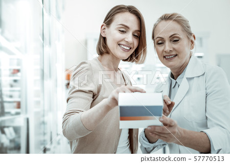 A well-favoured wife making study of pills prescription with apothecary 57770513