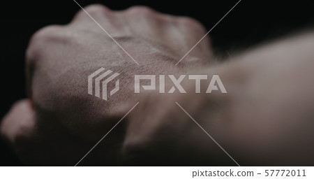 closeup pov man looking on his hand 57772011