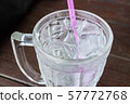 Close Up Glass of Cold Water with Ice and Straw 57772768