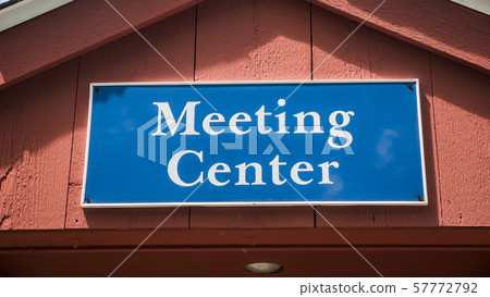 Signboard on a wooden house with the inscription Meeting Center Signboard on a wooden house with the inscription Meeting Center 57772792
