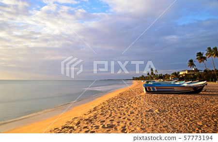 Sunset over desert beach at Nilaveli, Sri Lanka Sunset over desert beach at Nilaveli, Sri Lanka 57773194