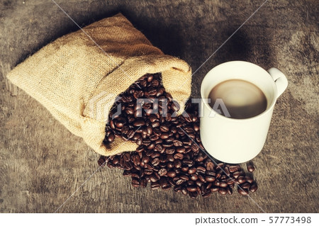 Coffee cup on a green background vintage. 57773498