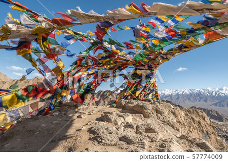 Colorful tibetan prayer flags on rock mountain in Colorful tibetan prayer flags on rock mountain in 57774009
