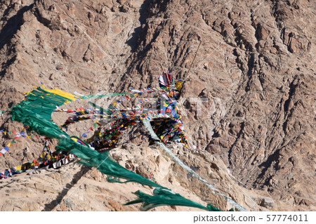 Colorful tibetan prayer flags on rock mountain in Colorful tibetan prayer flags on rock mountain in 57774011