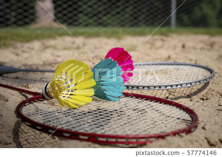 Colorful shuttlecocks with a badminton net Colorful shuttlecocks with a badminton net 57774146