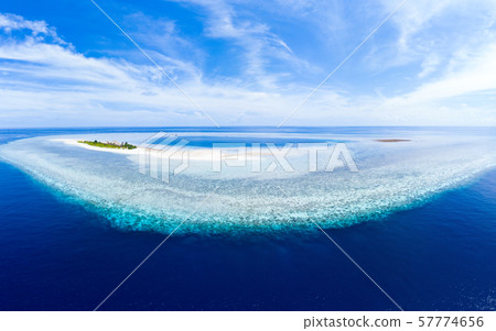 Aerial idyllic atoll, scenic travel destination 57774656