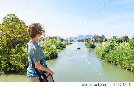 Woman looking at the Mekong River on the 4000 57774708