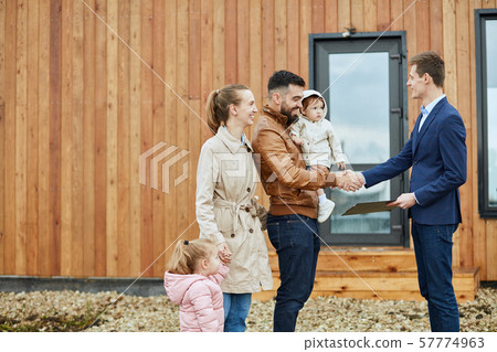 Caucasian family buy apartment with realtor 57774963