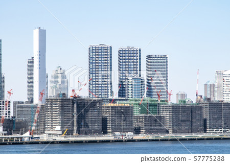 Waterside urban landscape with condominiums under construction Waterside urban landscape with condominiums under construction 57775288