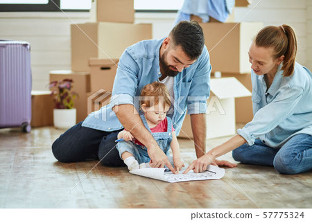 Caucasian family move in new big house 57775324