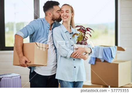Caucasian family move in new big house 57775355