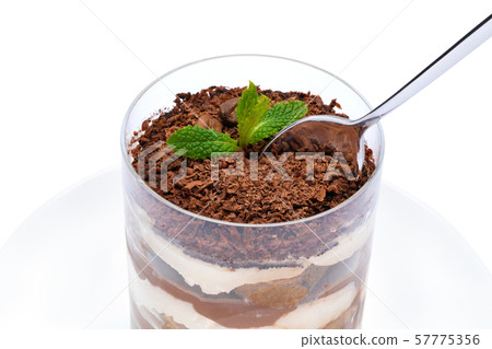 Classic tiramisu dessert in a glass cup on the plate on white background with clipping path Classic tiramisu dessert in a glass cup on the plate on white background with clipping path 57775356