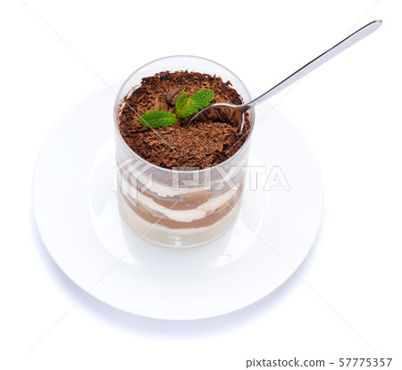 Classic tiramisu dessert in a glass cup on the plate on white background with clipping path Classic tiramisu dessert in a glass cup on the plate on white background with clipping path 57775357