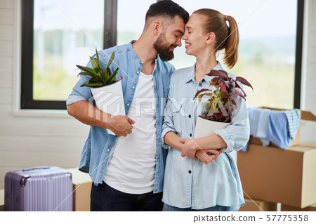 Caucasian family move in new big house Caucasian family move in new big house 57775358