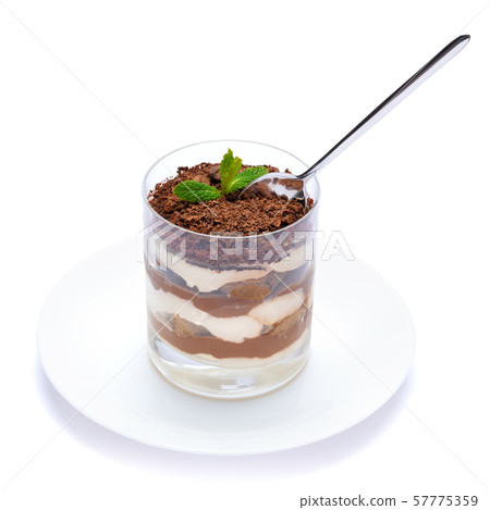 Classic tiramisu dessert in a glass cup on the plate on white background with clipping path Classic tiramisu dessert in a glass cup on the plate on white background with clipping path 57775359