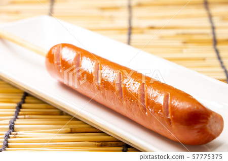 Frank with skewers (Frankfurter sausage on skewers). Frank with skewers (Frankfurter sausage on skewers). 57775375