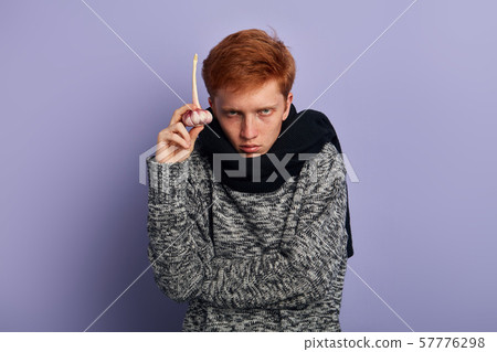 man suffers from cold, flu. 57776298