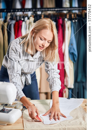 talented dressmaker making up a project, model talented dressmaker making up a project, model 57778432