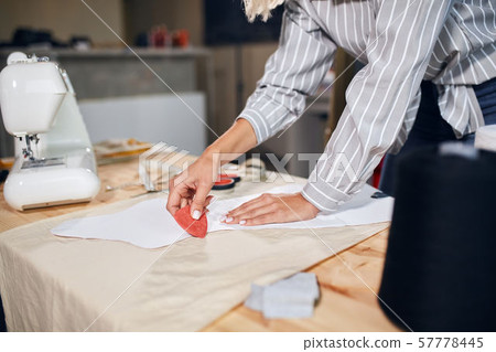 female tailor working with sketch 57778445
