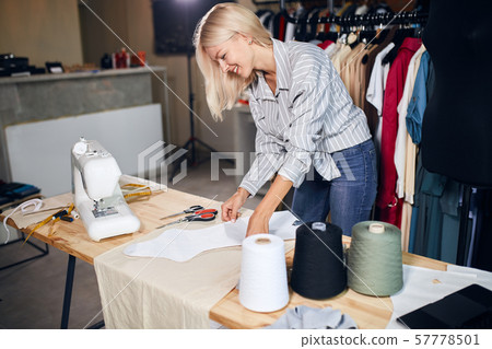 cheerful tailor going to sew a dress cheerful tailor going to sew a dress 57778501