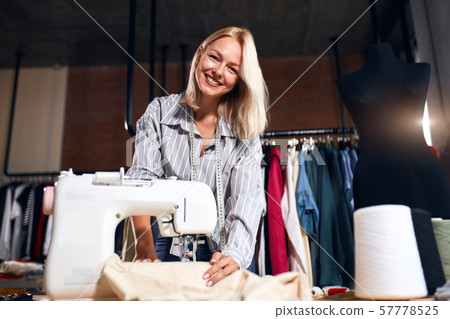 pretty lovely smiling girl is good at sewing pretty lovely smiling girl is good at sewing 57778525