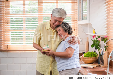 asian senior man surprise senior woman with 57778783