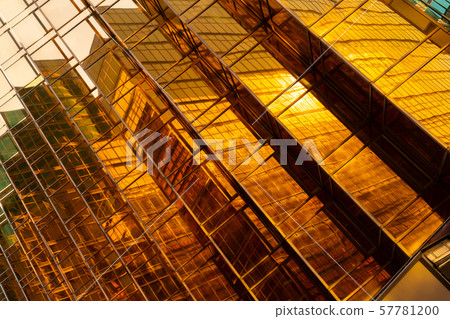 Golden building. Windows glass of modern office Golden building. Windows glass of modern office 57781200