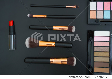 make up  and brushes  on black background 57782175