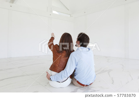 Couple at their new empty apartment Couple at their new empty apartment 57783870