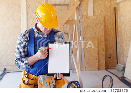 Foreman pointing at white folder Foreman pointing at white folder 57783876