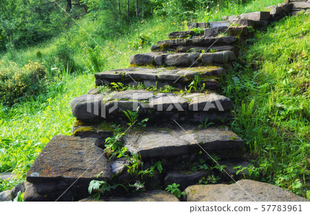 Stair of stones. Decorative element in the garden. 57783961