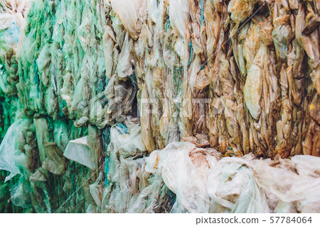 Pressed debris, bags from the product, polyethylene, garbage compacting, pressed. selective focus 57784064