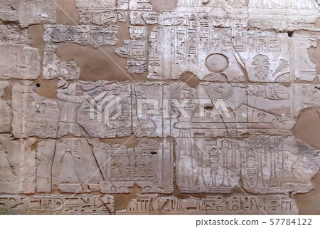 Hieroglyphs on wall of Karnak Temple Complex, famous architectural landmark in Luxor, Egypt. 57784122