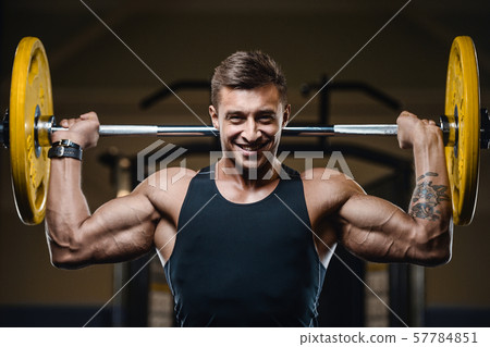 Handsome strong athletic men pumping up muscles Handsome strong athletic men pumping up muscles 57784851