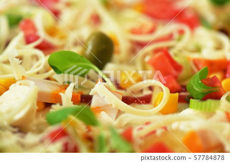 Delicious pizza with cheese and cherry tomatoes 57784878