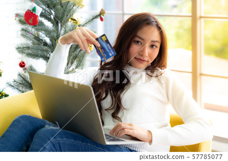 Young adult shopping Christmas Holiday Young adult shopping Christmas Holiday 57785077
