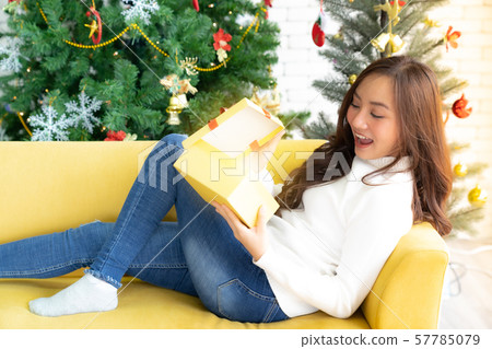 beautiful girl open christmas present gift box 57785079
